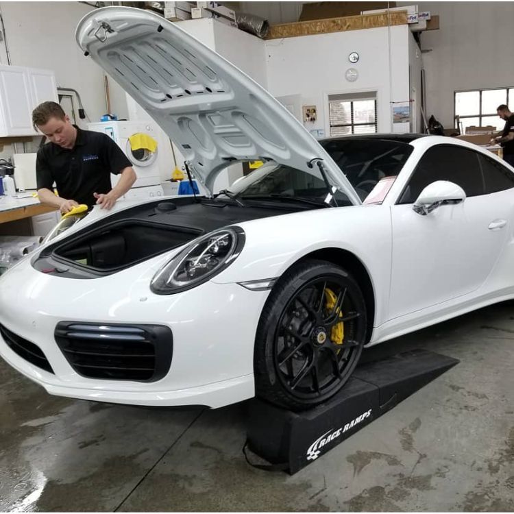 White Porsche 911 in shop
